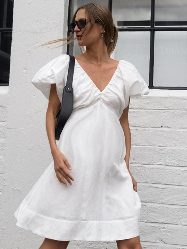 Beaumama robe mi-longue grossesse nœud papillon blanche